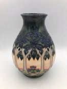 A 19cm Moorcroft tree themed vase.