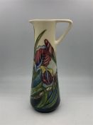 A Moorcroft Jug, 24 cm tall, in the Irises pattern