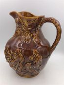 An Arthur Wood brown glazed jug 23cm tall.