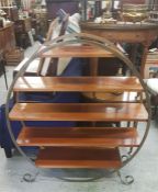 A Mid Century shelving unit, with circular theme.