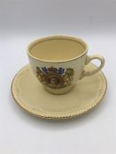 A 1952 Queen Elizabeth II Coronation cup and saucer by Clarice Cliff Newport Pottery
