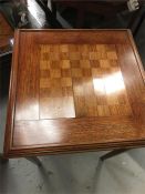 A small table with a chessboard design