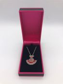 A silver pendant necklace set with enamel and marcasite in the Art Deco style