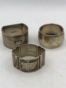 Three assorted hallmarked silver napkin rings