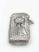 A silver vesta case with embossed cat decoration