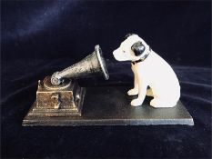 A cast iron HMV dog with a gramophone.