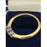 18ct yellow gold ring with three diamonds