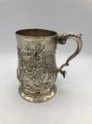 A George III silver pint mug with later Victorian embossed decoration London 1782