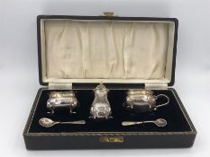 A Cased cruet set hallmarked Birmingham 1953/54