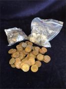 A quantity of farthings, brass three pence coins and sixpences some pre 1947 silver