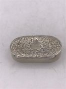 An ornate hallmarked silver vinaigrette