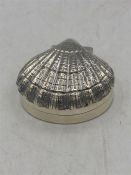 A Silver jewellery box of shell shape