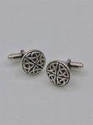 A pair of silver Celtic cufflinks