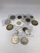 A quantity of Canadian coins, two silver dollars, silver 25cents and 5 cents, plus other older