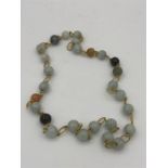 A jade necklace with 14ct gold links