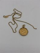 A 1924 Gold sovereign in a Asian gold mount on Asian gold chain (Total weight 18.4g)