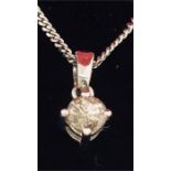 An 18ct white gold single stone pendant necklace on 36 points