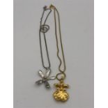 Two necklaces with dipped Orchid pendants in silver and gold.