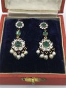 A boxed set of costume earrings made in India.