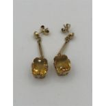 A pair of 9ct yellow gold earrings with citrines