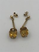 A pair of 9ct yellow gold earrings with citrines