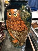 A Moorcroft vase with an owl design.