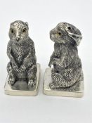 A Pair of 800 Continental silver rabbit condiments