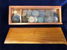 Brown wooden box containing a quantity of pennies including some Victorian and other assorted coins