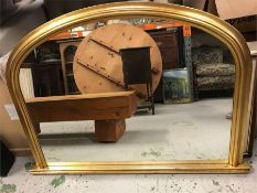 A Half Moon over mantle mirror.