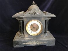 A slate clock with key