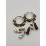 Three pairs of earrings on Asian gold settings (Total weight 12.8g)