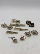 A Selection of car themed tie pins and cuff links