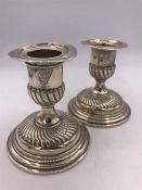 A Pair of silver candlesticks, hallmarked London 1889.