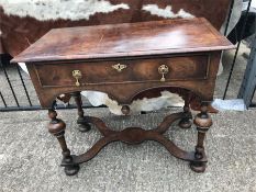 A Ladies desk in mahogany with cross banded legs