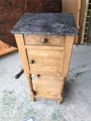 A PIne cupboard on pillar legs with a marble top,