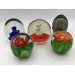 A selection of five vintage paperweights