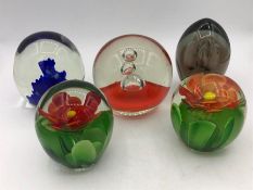 A selection of five vintage paperweights