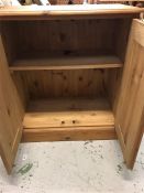 A Pine two door cupboard