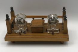 A wooden ink stand with cut glass inkwells