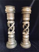 A pair of twisted wood candle sticks.