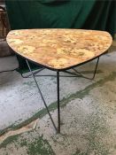 A Mid Century floral formica triangular coffee table on metal legs.