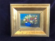 An oil on canvas of flowers in a blue pot in a gilt frame signed bottom right Je Fuz (27cm x 31cm)