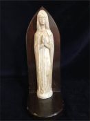 A carved figure of Our Lady