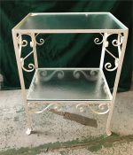A Two tier glass a wrought iron table