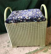 A Lloyd Loom laundry basket