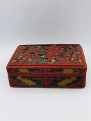 A Chinese red lacquered and carved box