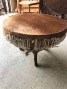 A cow hide table or footstool
