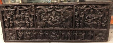 An Indian carved panel, 20th Century, 121cm x 46cm.