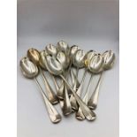 A set of twelve spoons by WH & Sons Ltd (940g)