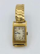 A Butchers and Swann 9ct gold watch